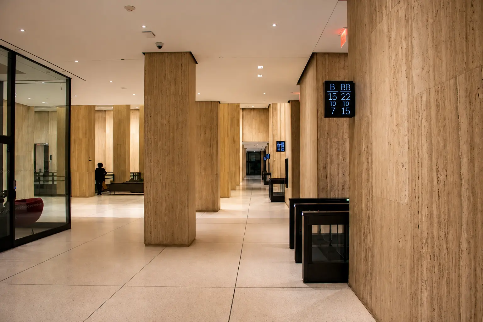 Warm, modern elevator lobby with premium interior finishes.