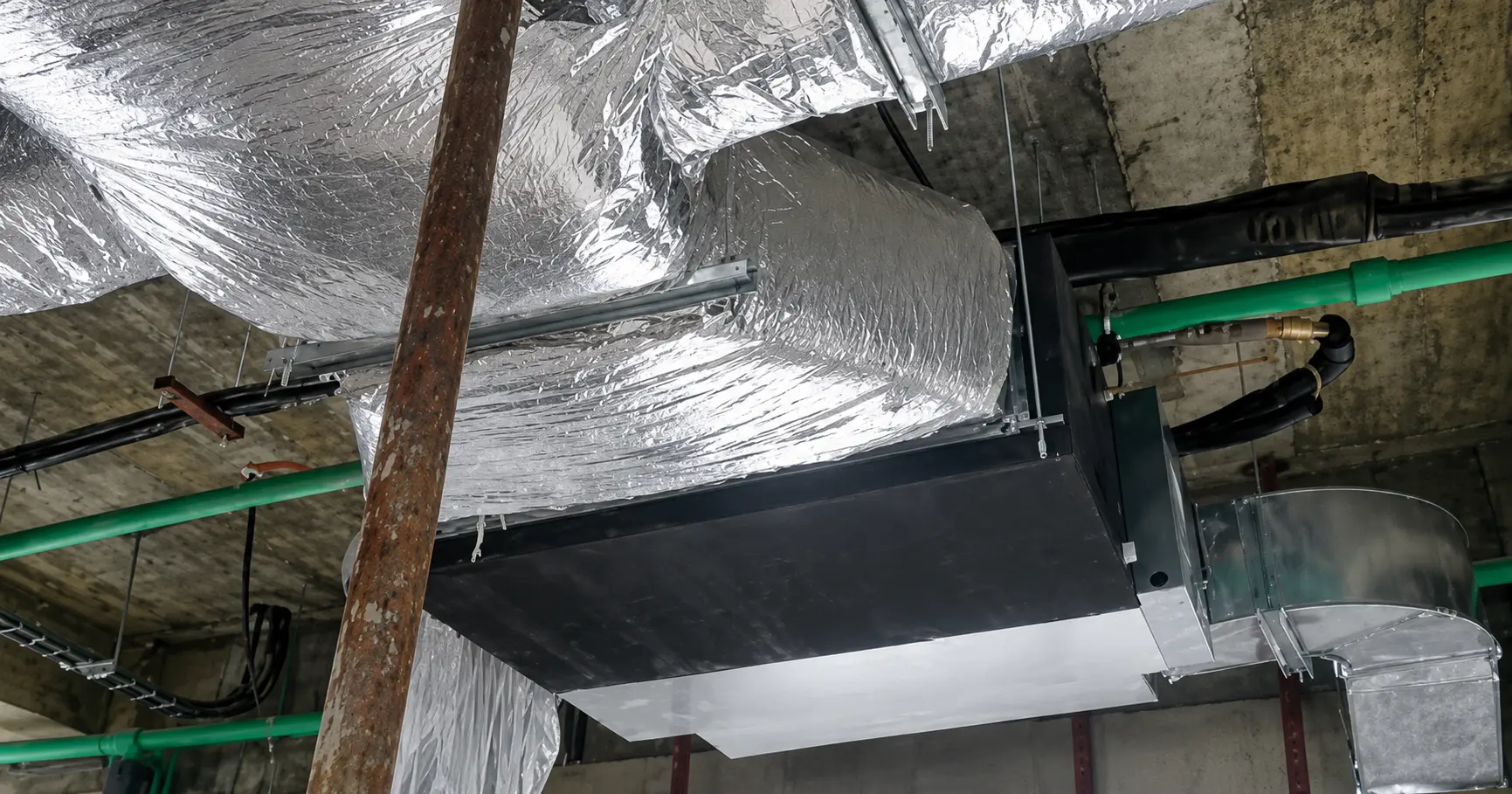 Insulated ductwork and ceiling-mounted air handling unit at the Abuja Clinic